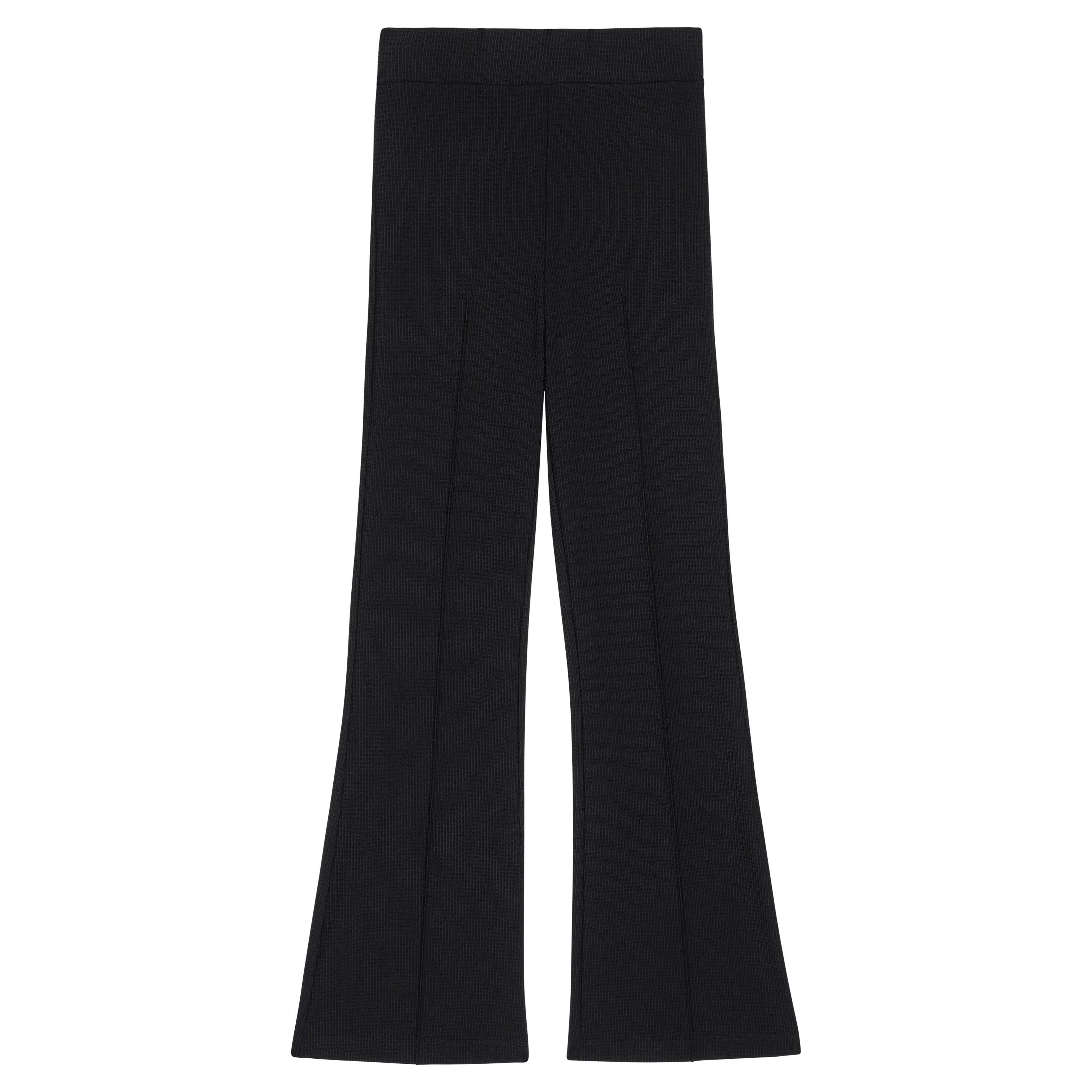 A pair of Donni The Box Weave Stretch Kick Flare pants by Donni, featuring a high-waisted, flared design in a jet black color. Made from textured, rib-knit fabric, these pants include a wide waistband and vertical seams down the front of each leg.