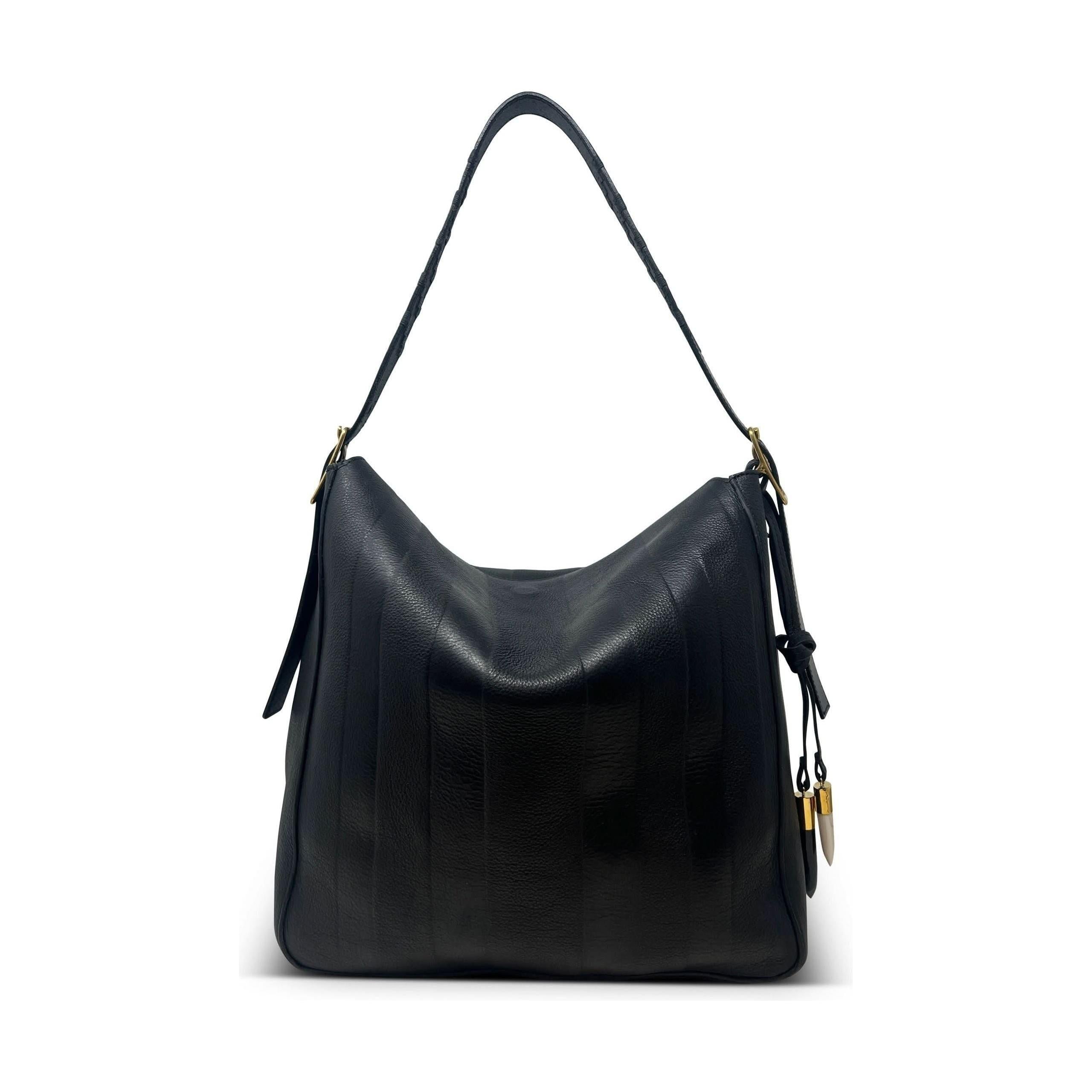 The Kempton & Co Hobo Black Heated Stripe, by Kempton & Co, is a stylish black leather handbag featuring embossed leather and a single shoulder strap with gold accents. It showcases subtle vertical stitching, a decorative tassel on one side, and a convenient magnetic closure. Its spacious and slouchy design is perfect for complementing any outfit.