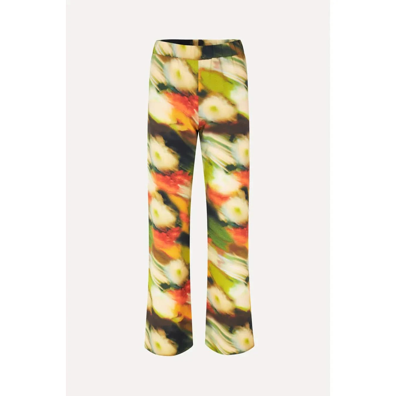 Stine Goya's Marc Pants Flowers in Fast Motion are loose-fitting, high-waisted trousers featuring a vibrant abstract floral pattern in shades of green, yellow, orange, and red. Made from a recycled polyester blend, the pattern creates a blurred effect, and the trousers have a straight-leg design.