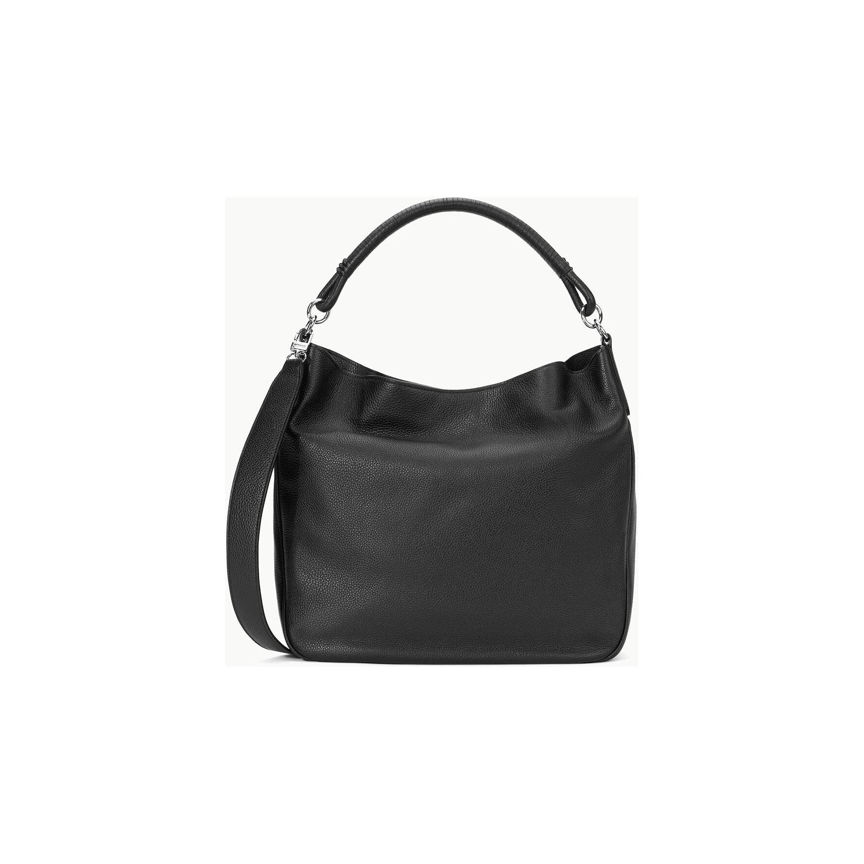 The Staud Perry Bag in black is a hobo tote that showcases a curved top handle and an adjustable shoulder strap. Made from pebbled leather, it presents a polished and elegant appearance against a plain white background.