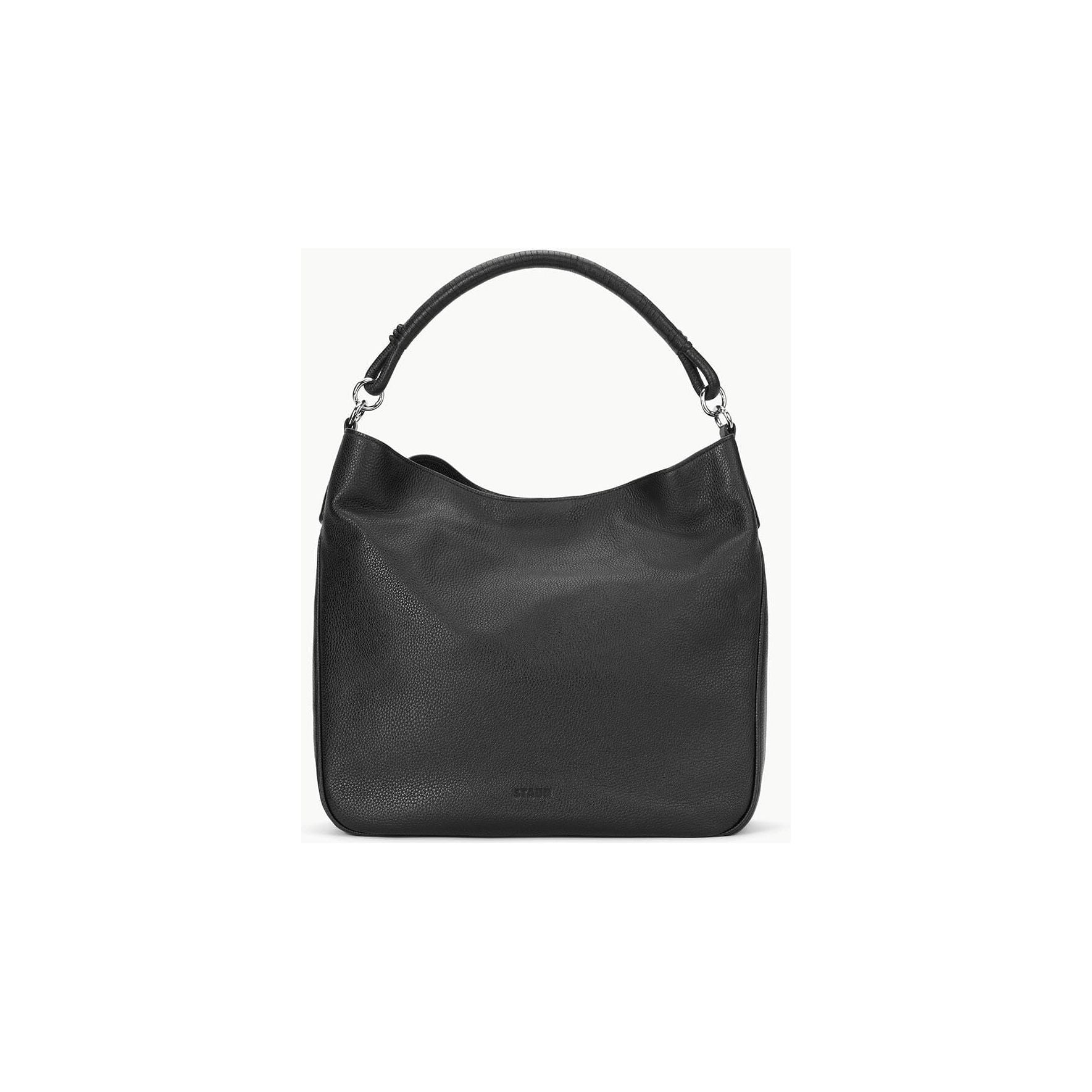 The Staud Perry Bag in black is a mid-size hobo shoulder bag made from pebbled leather. It features a single strap and silver-tone hardware. Its slouchy design and minimalistic style make it perfect for everyday use, elegantly displayed against a light grey background.