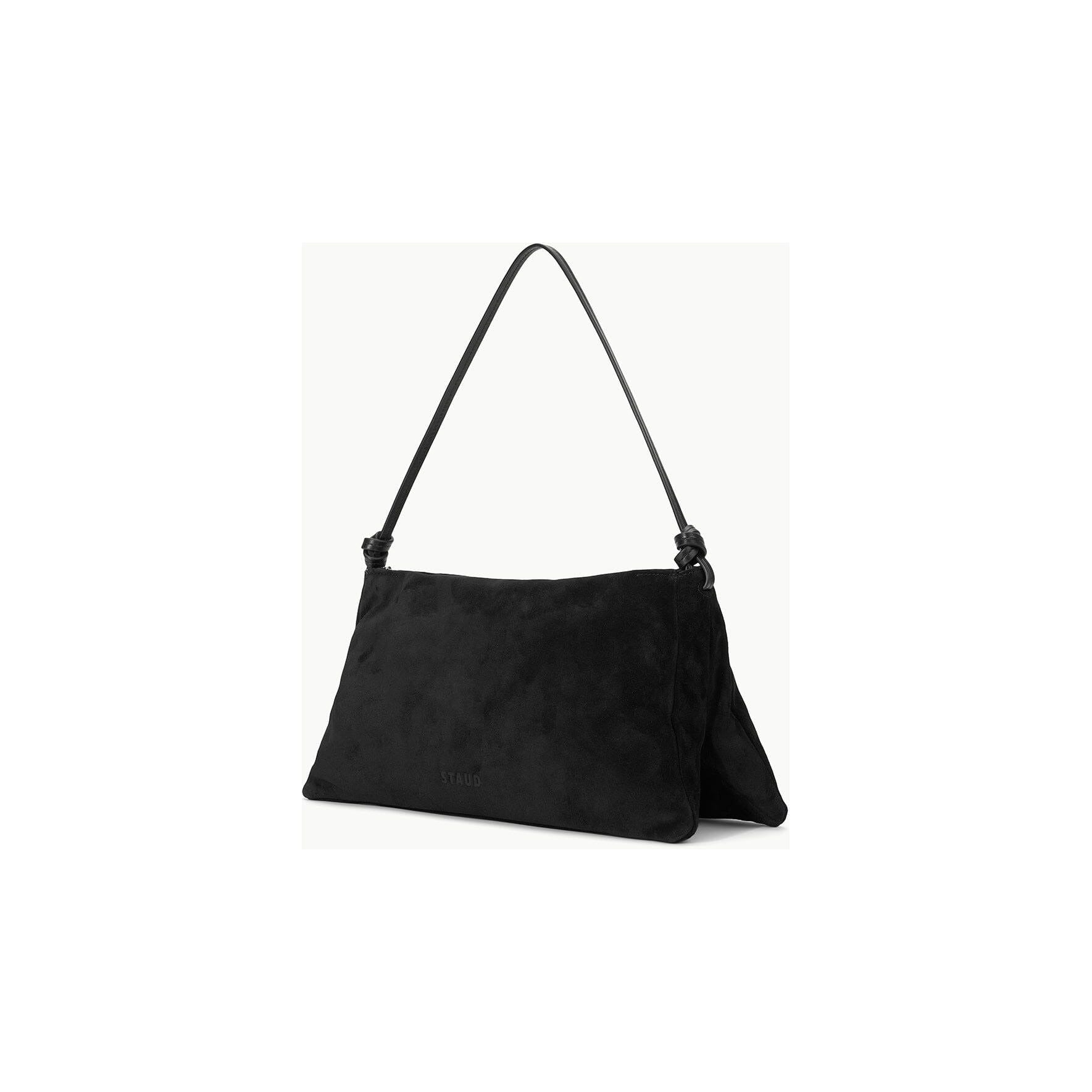 A black, rectangular suede handbag from Staud, known as the Wally Bag, is displayed against a plain white background. This chic shoulder bag features a minimalistic design with subtle stitching and the brand name embossed on its cow leather surface.